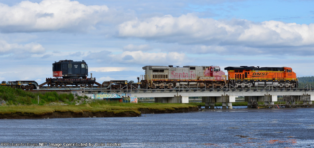 BNSF 6054 leading war-bonnet BNSF 631 and a mixed freight consist S/B across the Mud Bay crossing.